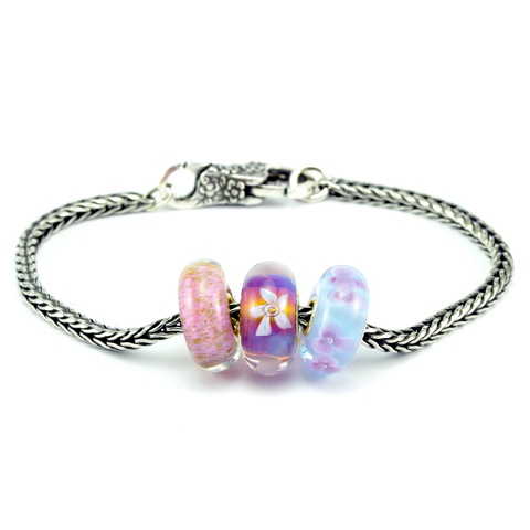 Don't know what beads she likes? Why not chose this beautifully feminine Trollbeads Floral Romance Glass Bead Bracelet. You can buy the beads individually or make life easy for yourself by choosing this stunning ready-made bracelet. If you buy the beads and bracelet separately it is £155 but NOW it is £140 