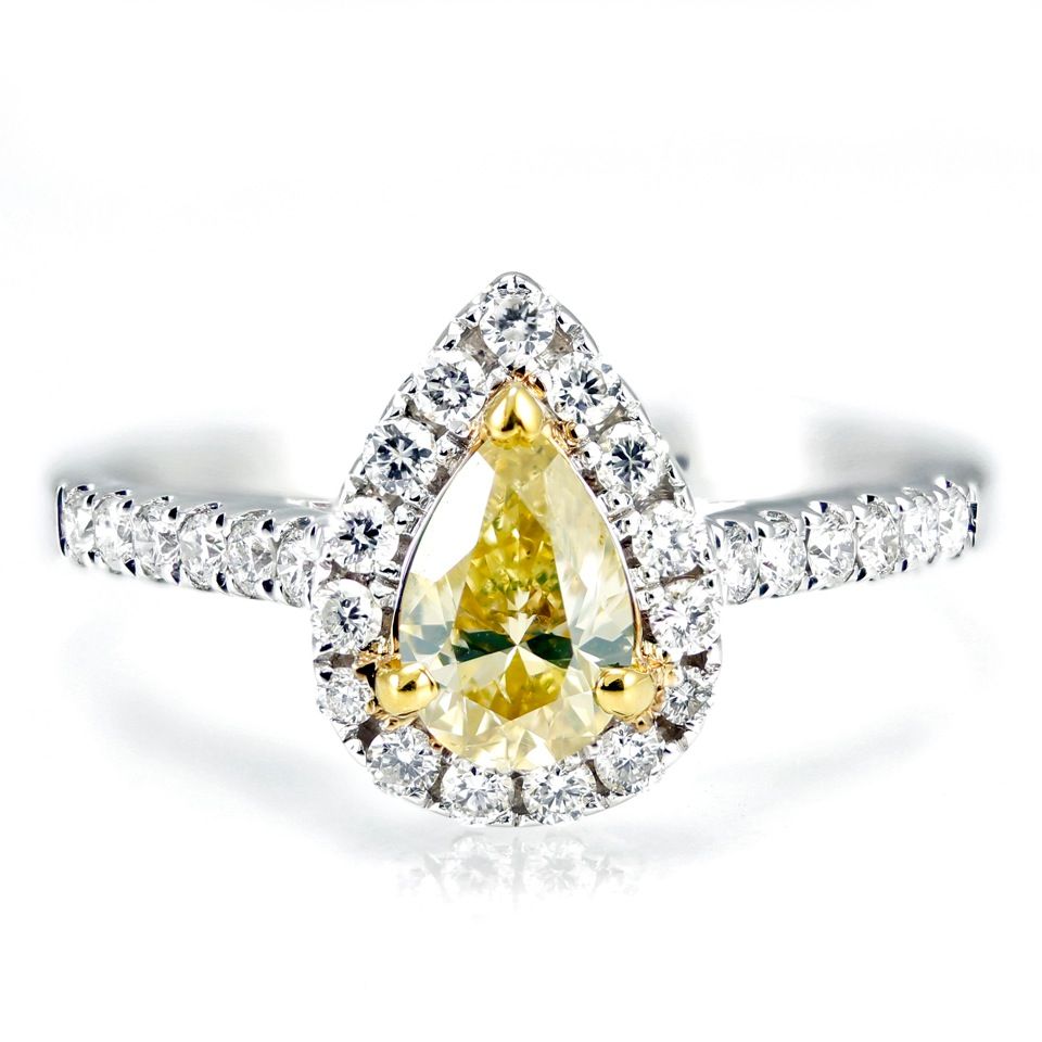 Pear shaped yellow diamond engagement ring with halo