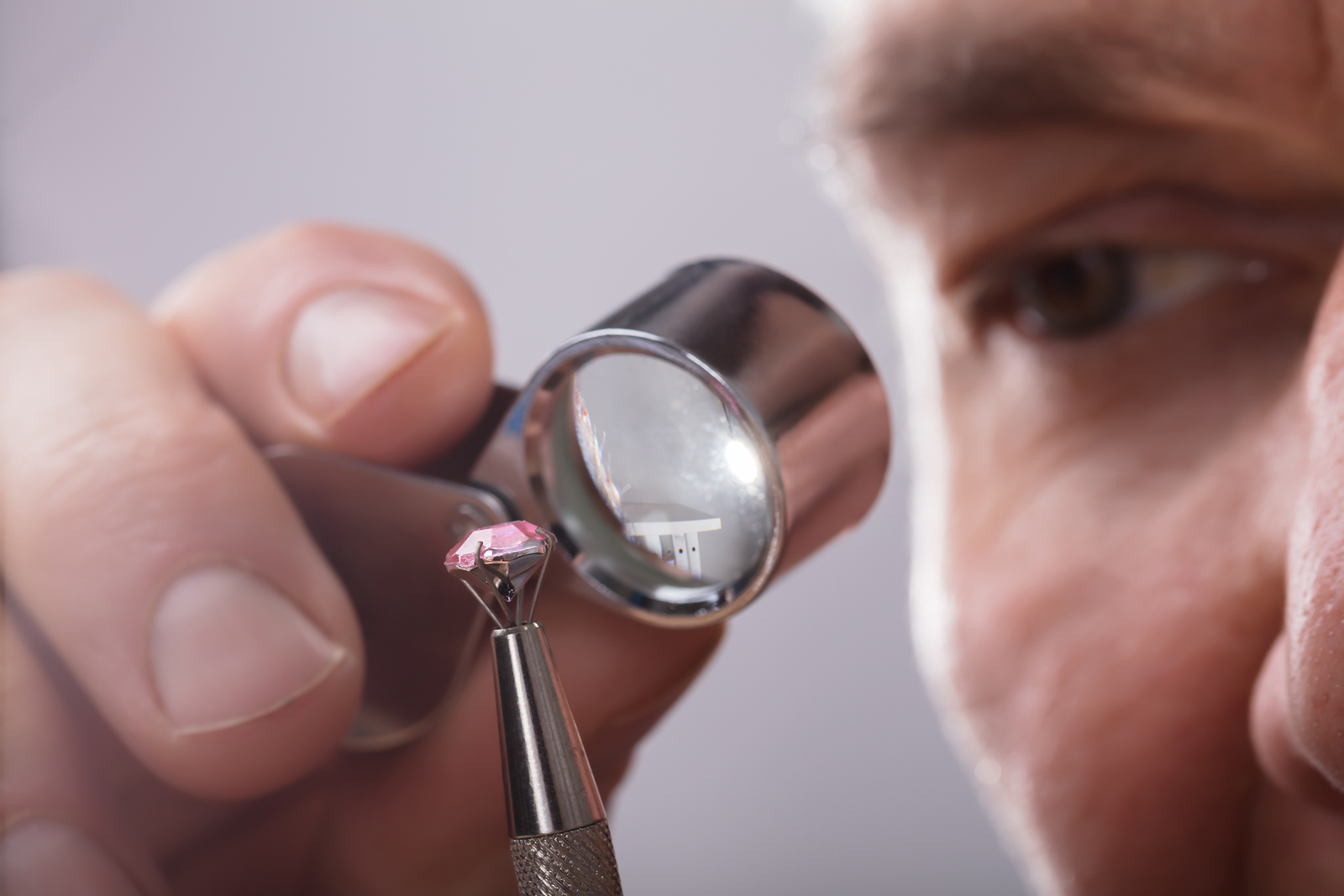 jeweller looking at a diamond