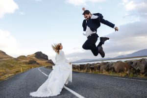Groom leaping next to bride - leap year concept