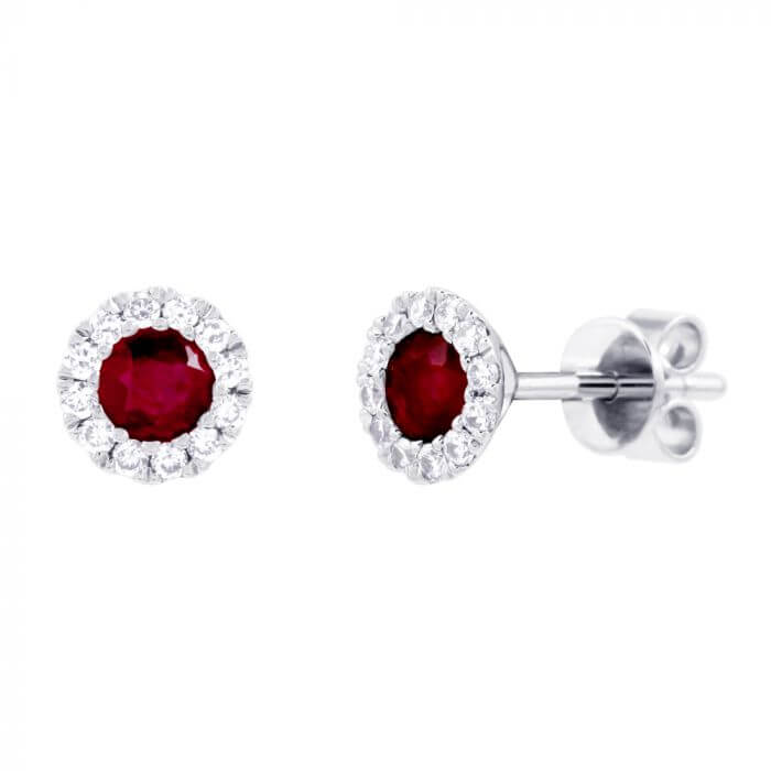 Ruby jewel earrings surrounded by diamonds.