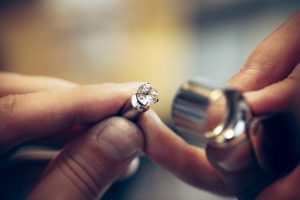 jeweller looking at a diamond