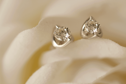 Stud diamond earrings from Robert Gatward Jewellers. Learn how to style diamonds into your everyday outfits.