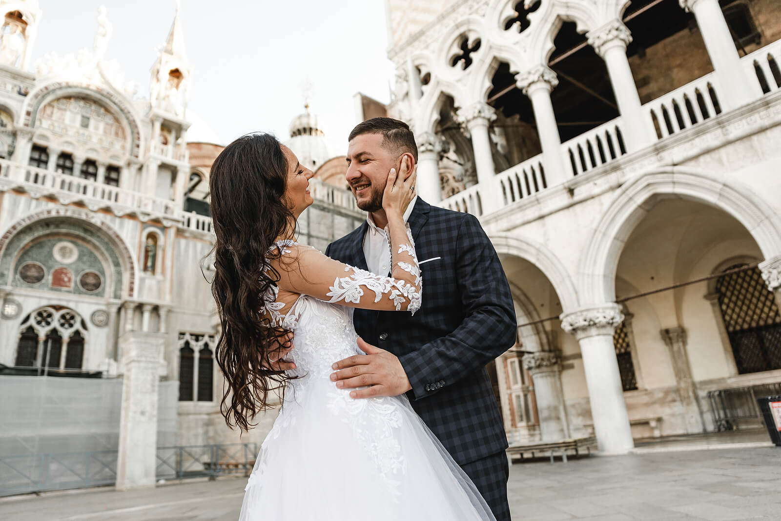 lovely newlyweds,happy wedding couple cuddling a walk in venice,italian wedding dresses
