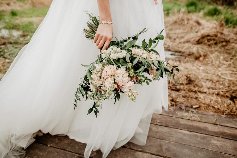 Wedding bouquet of the bride in womens hands. wedding flowers. Bridal bouquet of fresh flowers, wedding concept